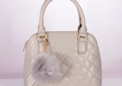 Pale Grey Quilted Kettle Bag with Pom Pom Charm